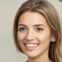 Joyful white young-adult female with long  brown hair and green eyes