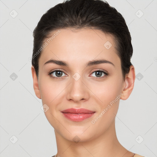 Joyful white young-adult female with short  brown hair and brown eyes