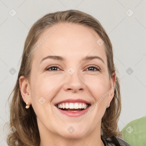 Joyful white adult female with medium  brown hair and grey eyes