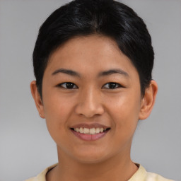 Joyful asian young-adult female with short  black hair and brown eyes