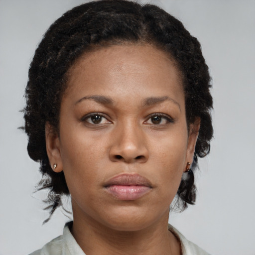 Neutral black young-adult female with short  brown hair and brown eyes