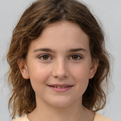 Joyful white child female with medium  brown hair and brown eyes