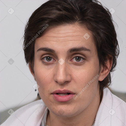 Joyful white adult female with medium  brown hair and brown eyes