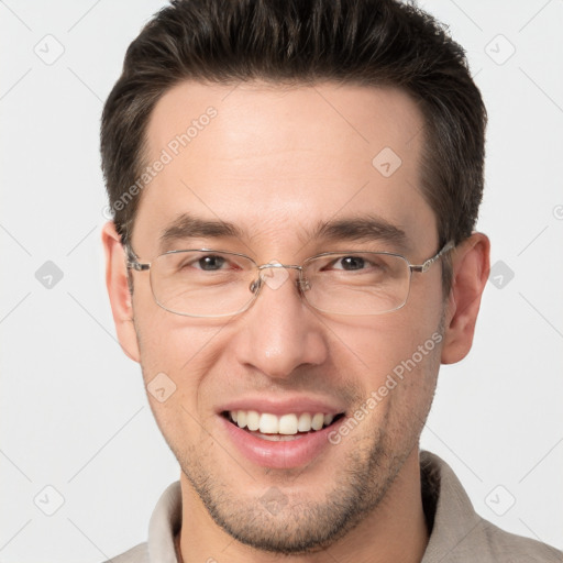 Joyful white adult male with short  brown hair and brown eyes