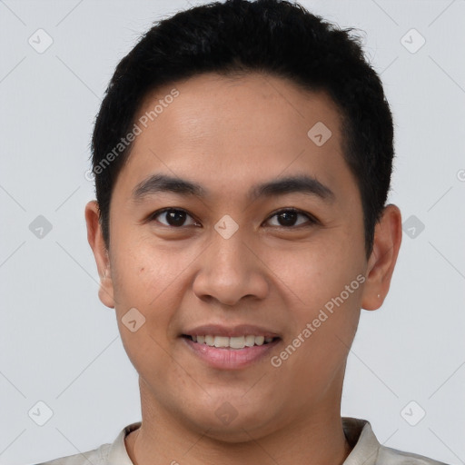 Joyful latino young-adult male with short  brown hair and brown eyes