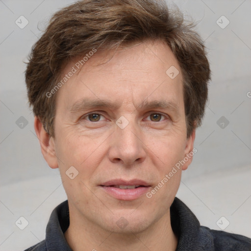 Joyful white adult male with short  brown hair and grey eyes