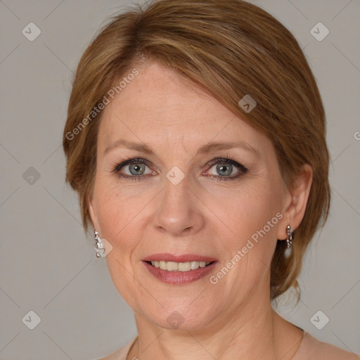 Joyful white adult female with medium  brown hair and grey eyes