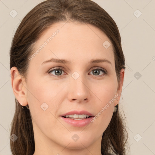 Joyful white young-adult female with long  brown hair and grey eyes