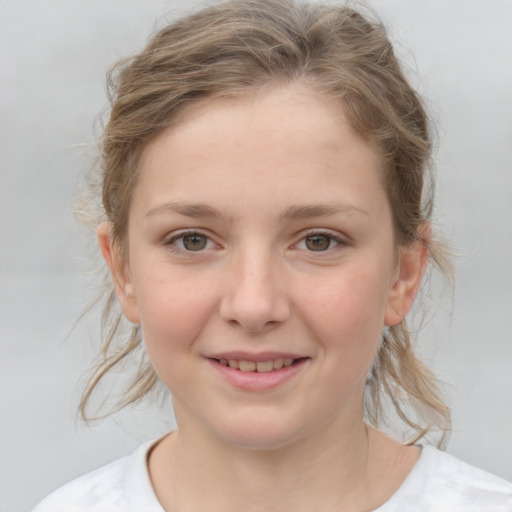 Joyful white child female with medium  brown hair and grey eyes