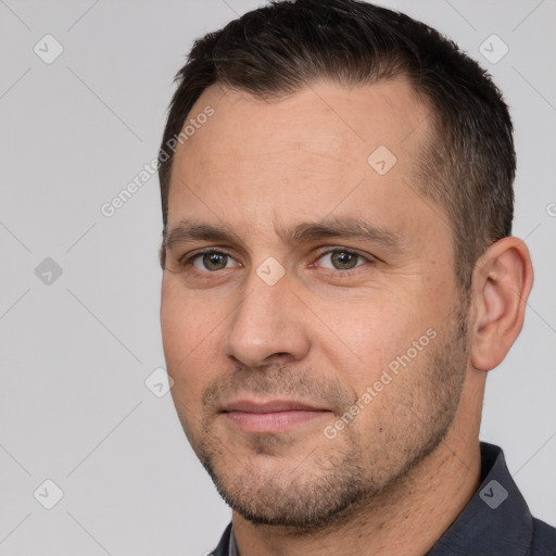 Joyful white adult male with short  brown hair and brown eyes