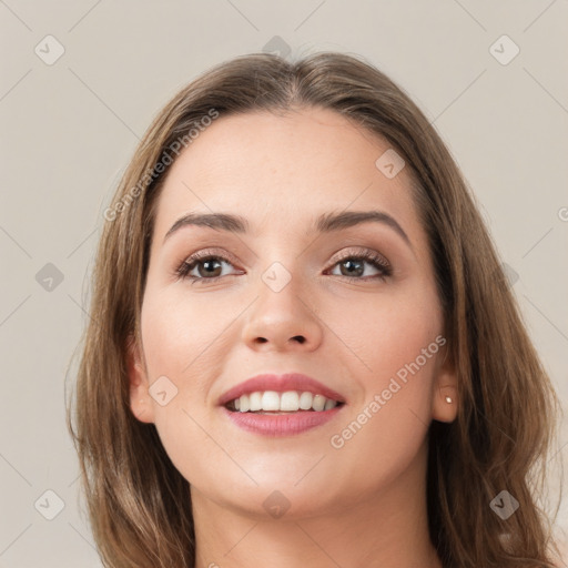 Joyful white young-adult female with long  brown hair and grey eyes