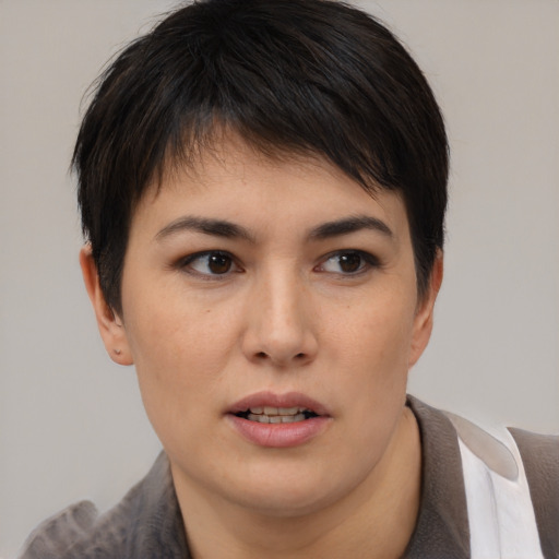 Joyful white young-adult female with short  brown hair and brown eyes