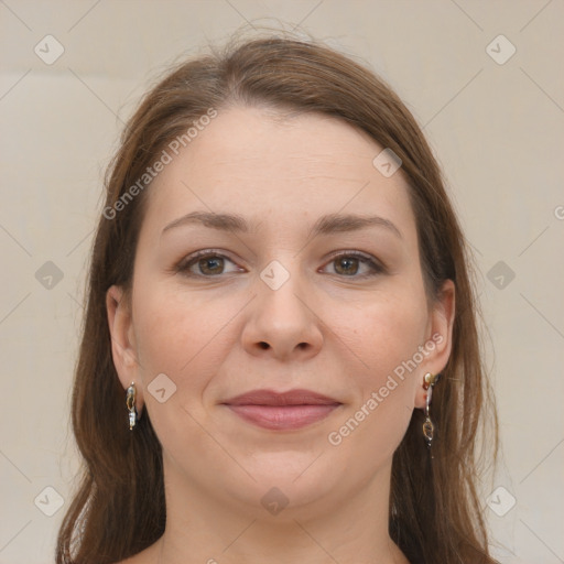 Joyful white young-adult female with long  brown hair and grey eyes