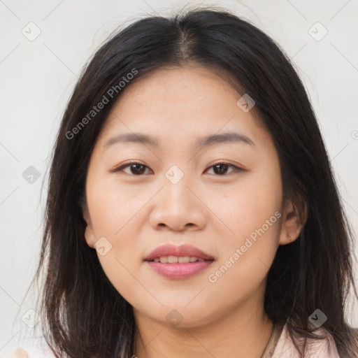 Joyful asian young-adult female with long  brown hair and brown eyes