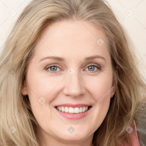 Joyful white young-adult female with long  brown hair and blue eyes