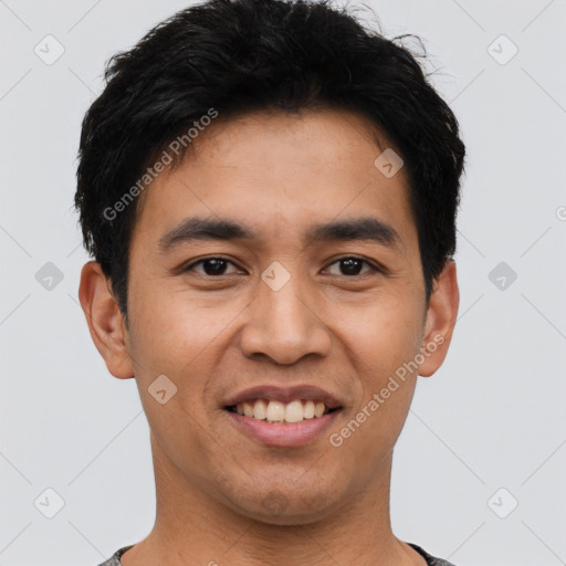 Joyful asian young-adult male with short  black hair and brown eyes