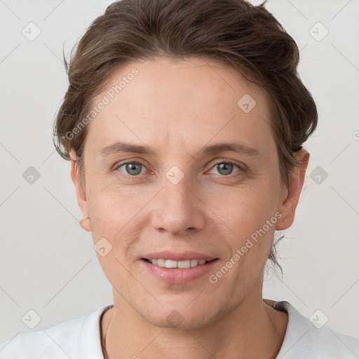 Joyful white young-adult female with short  brown hair and grey eyes