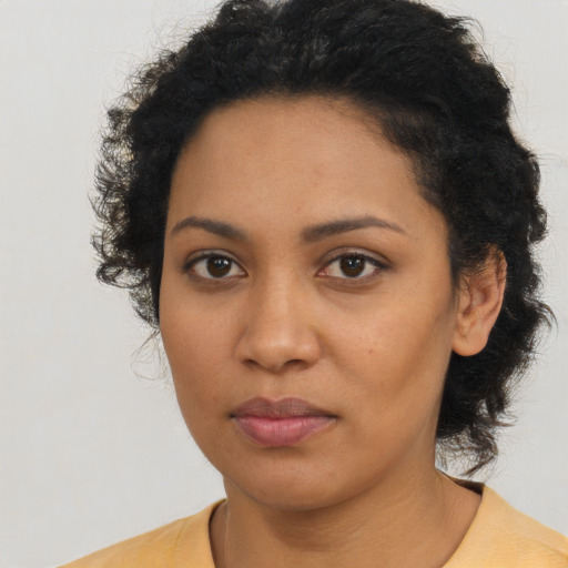 Neutral latino young-adult female with short  brown hair and brown eyes