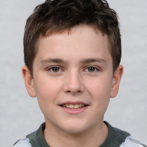 Joyful white child male with short  brown hair and brown eyes