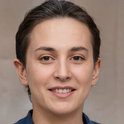 Joyful white young-adult female with medium  brown hair and brown eyes