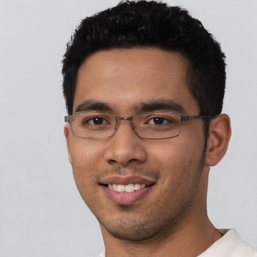 Joyful asian young-adult male with short  black hair and brown eyes