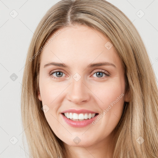 Joyful white young-adult female with long  brown hair and green eyes