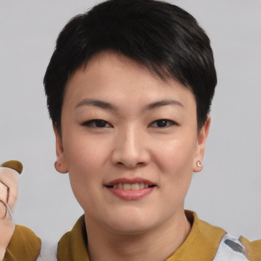 Joyful asian young-adult female with short  brown hair and brown eyes