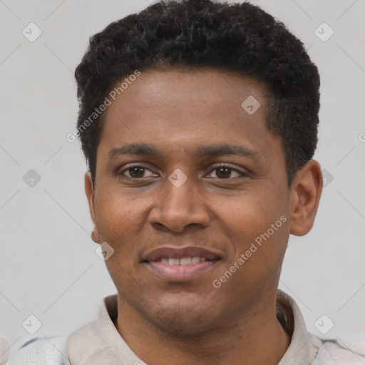Joyful black young-adult male with short  brown hair and brown eyes