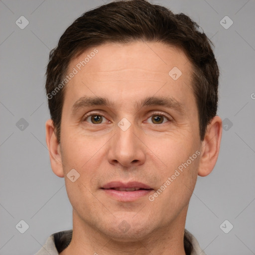 Joyful white adult male with short  brown hair and grey eyes