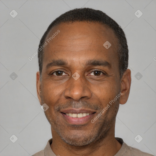 Joyful latino adult male with short  black hair and brown eyes