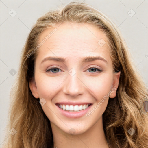 Joyful white young-adult female with long  brown hair and blue eyes