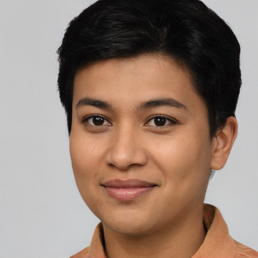 Joyful asian young-adult female with short  brown hair and brown eyes