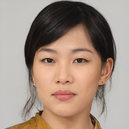 Neutral asian young-adult female with medium  brown hair and brown eyes