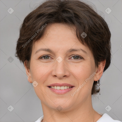 Joyful white adult female with short  brown hair and grey eyes