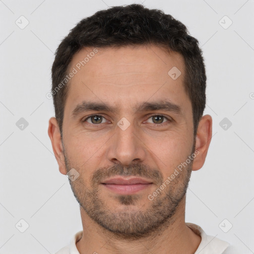 Joyful white young-adult male with short  brown hair and brown eyes