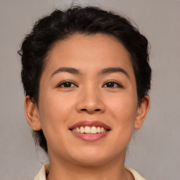 Joyful asian young-adult female with short  brown hair and brown eyes