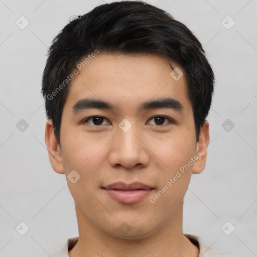 Joyful asian young-adult male with short  black hair and brown eyes