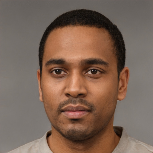 Neutral black young-adult male with short  black hair and brown eyes