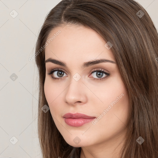 Neutral white young-adult female with long  brown hair and brown eyes