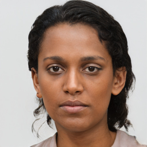 Neutral black young-adult female with short  brown hair and brown eyes