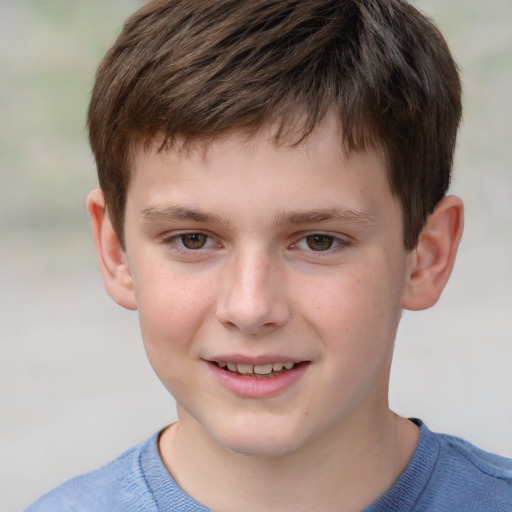 Joyful white child male with short  brown hair and brown eyes