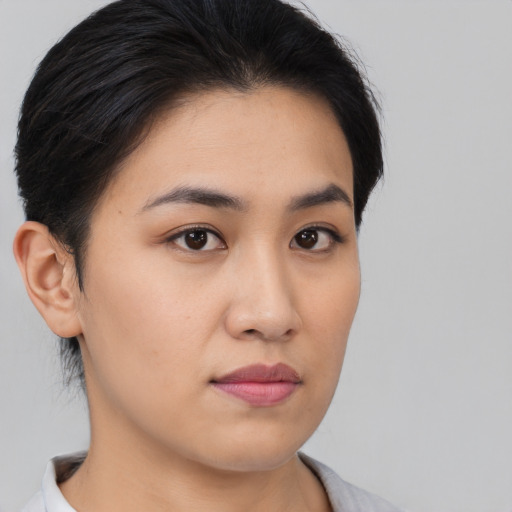 Neutral asian young-adult female with medium  brown hair and brown eyes