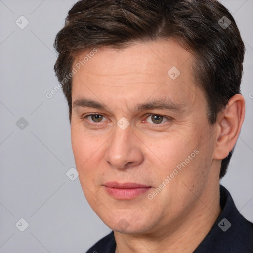 Joyful white adult male with short  brown hair and brown eyes