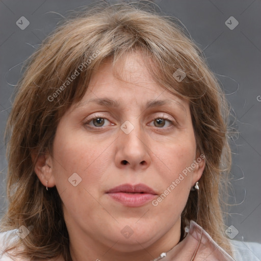 Joyful white adult female with medium  brown hair and grey eyes