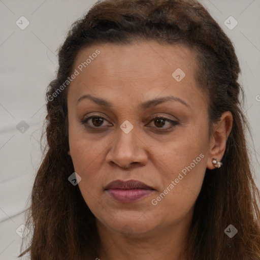 Joyful white adult female with long  brown hair and brown eyes