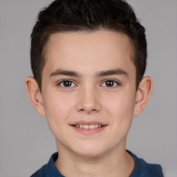 Joyful white child male with short  brown hair and brown eyes