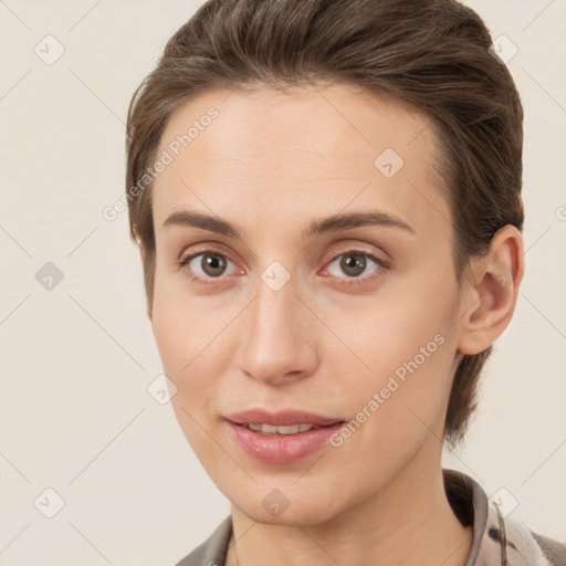 Joyful white young-adult female with medium  brown hair and grey eyes