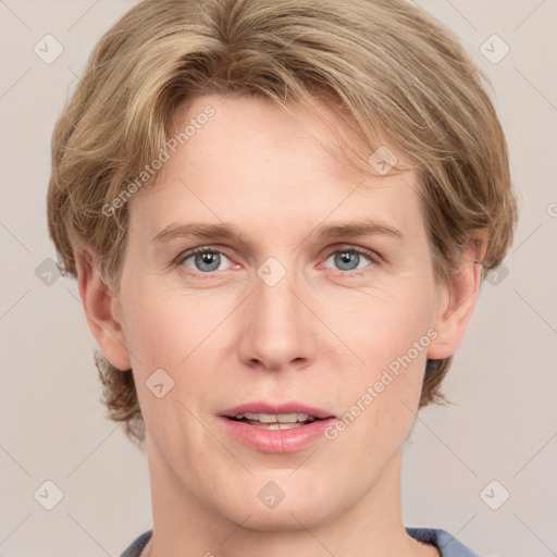 Joyful white young-adult female with medium  brown hair and blue eyes