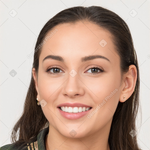 Joyful white young-adult female with long  brown hair and brown eyes