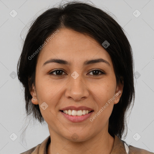 Joyful latino young-adult female with medium  brown hair and brown eyes